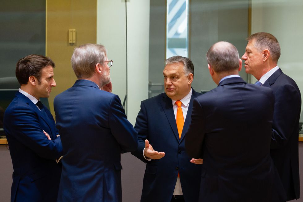 Prime Minister of Hungary Viktor Orban talks with President of France Emmanuel Macron, Prime Minister of Czech Republic Petr Fiala and President of Romania Klaus Werner Iohannis during the European Union leaders' summit on March 25. The summit was held amid Russia's invasion of Ukraine.