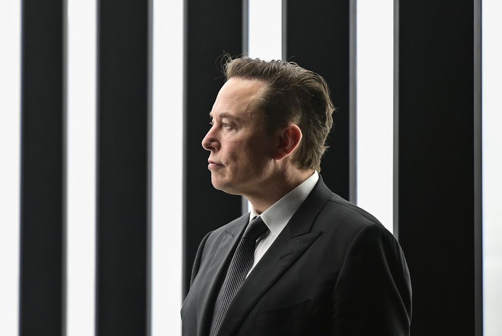 Profile of Elon Musk with a black and white background