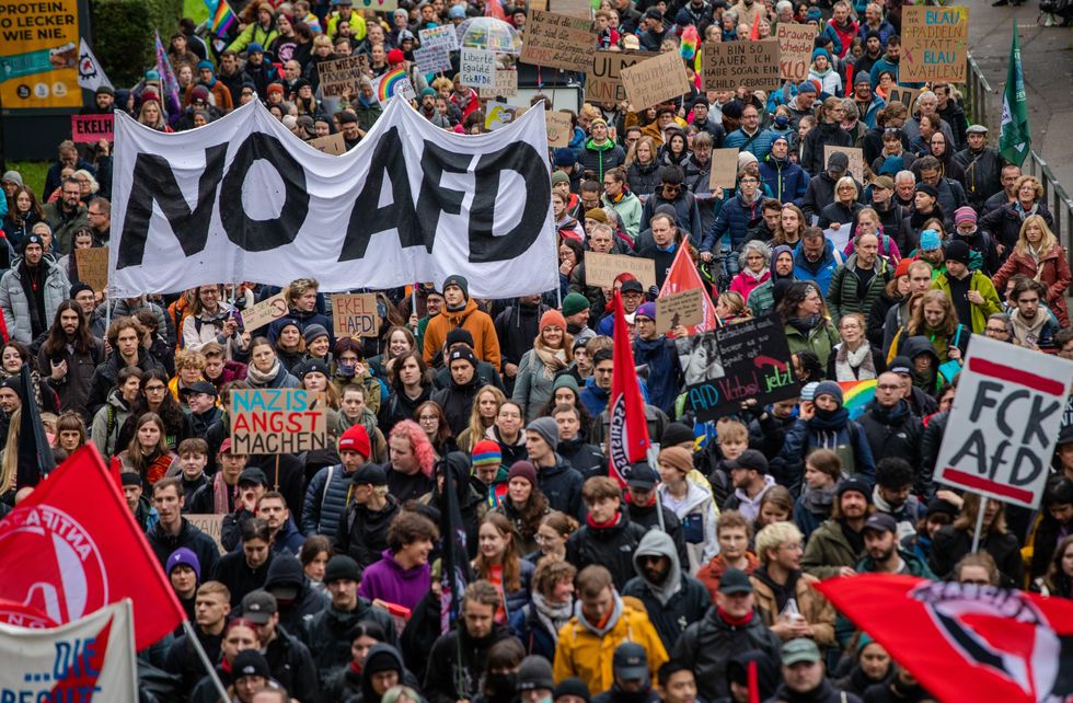 Protest against AfD. Signs held by protestors read "NO AFD" and "FCK AFD".