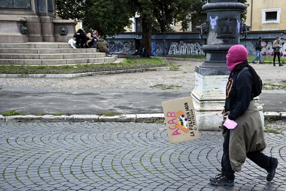 Protester with sign during the demonstration against violence on women in Rome