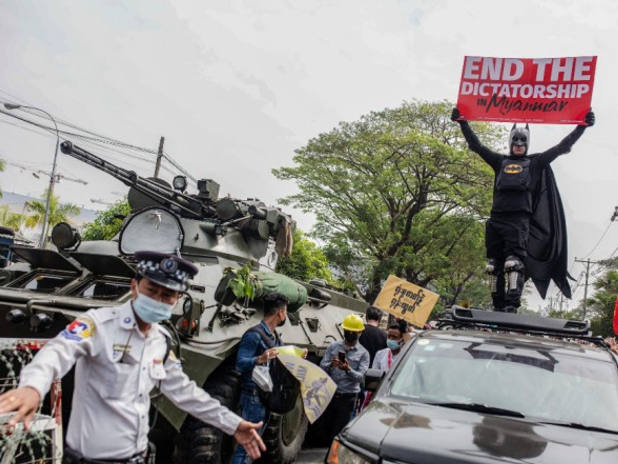 Protesters continue to demonstrate in the streets of Yangon, Myanmar, despite the heightened military presence and the deployment of armored vehicles