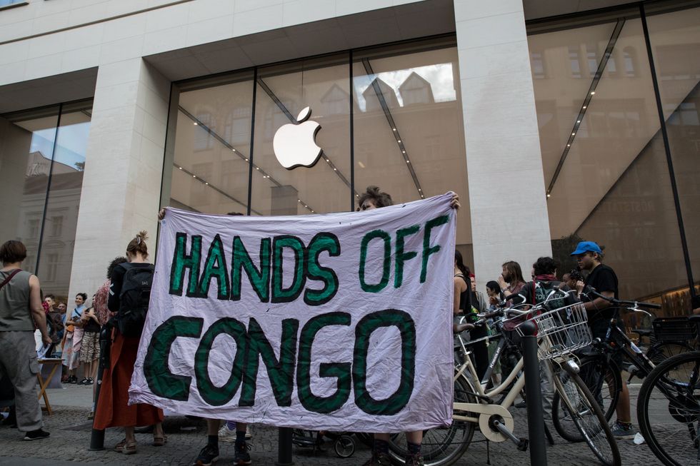 Protesters gather in front of an Apple store in Berlin, Germany.