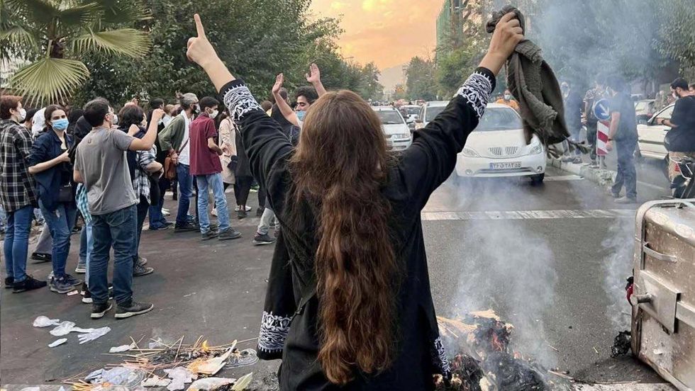 Protesters in the streets in Iran following the death of Mahsa Amini