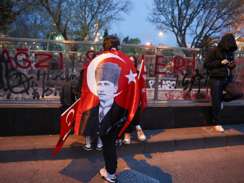 Protesters wave Turkish flags during a 7th nighttime rally in Istanbul, Turkey, on March 25, 2025.