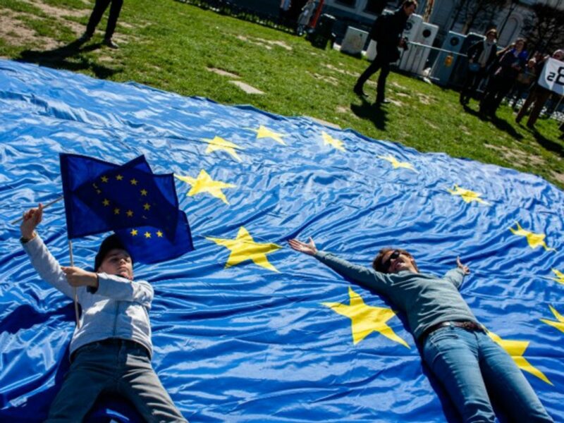 Protestors lay on European Union flag at citizens' march in Brussels, Belgium