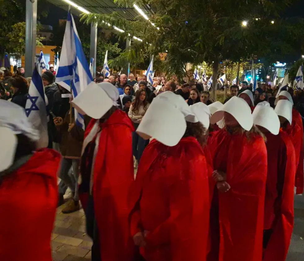 Protests in Tel Aviv, as an attempt to separate the state from religion, with protestors wearing Handmaid's costume.
