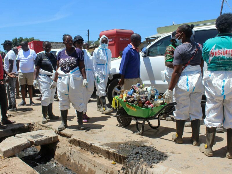 Public health workers cleaning the streets.