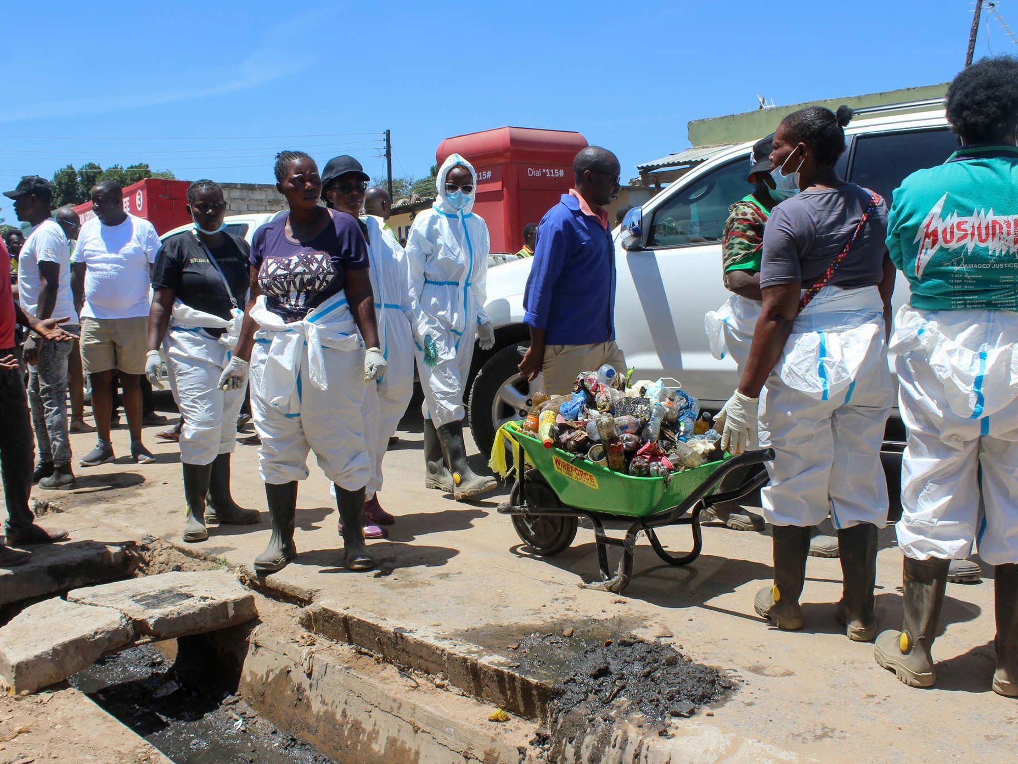 Public health workers cleaning the streets.