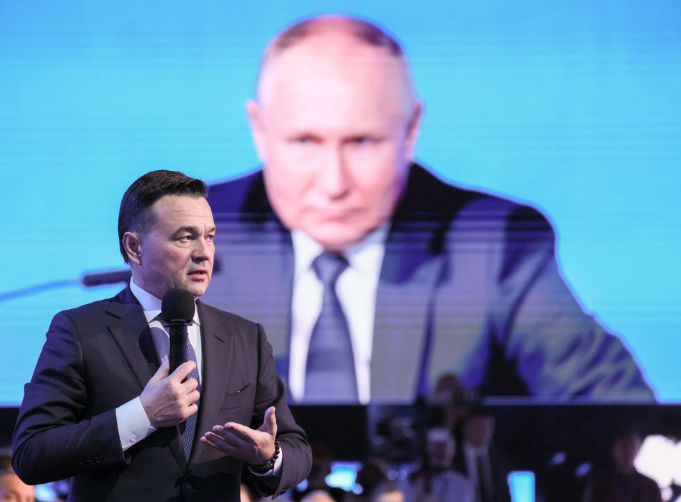 Putin's joins the AI conference virtually and his face looks towards the speaking Moscow Region Governor Andrei Vorobyev