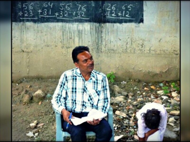 Rajesh Kumar teaching at "railway school"