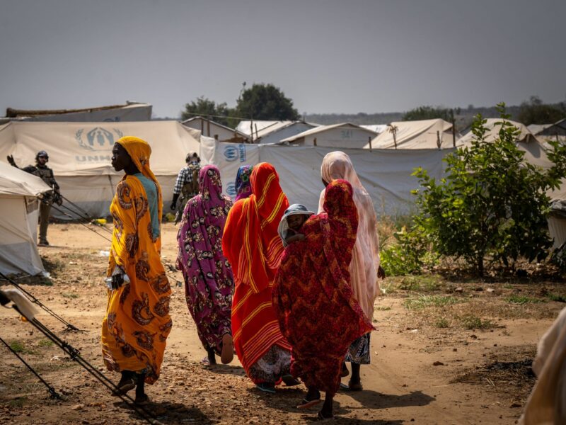 Refugee women walk