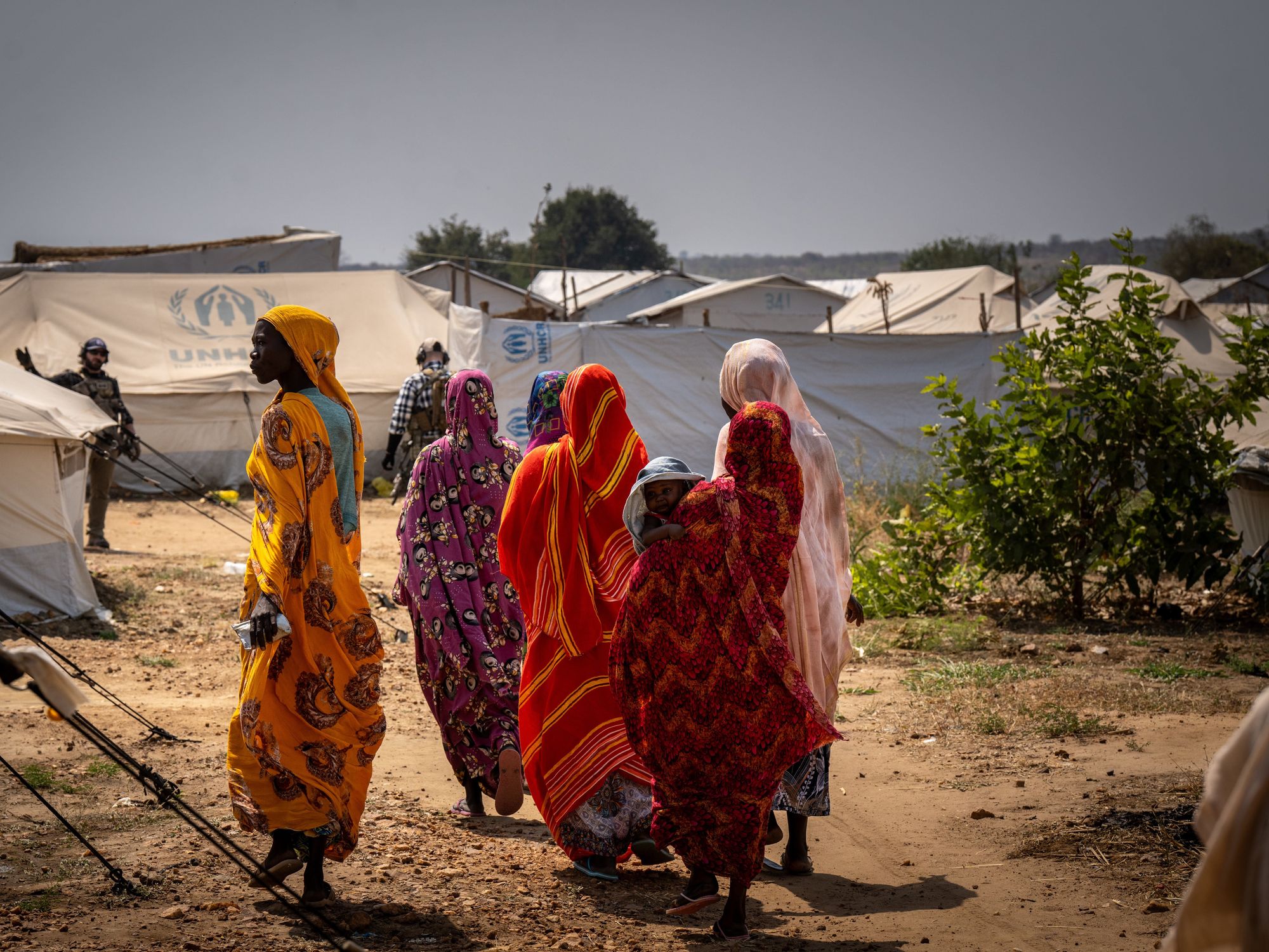 Refugee women walk