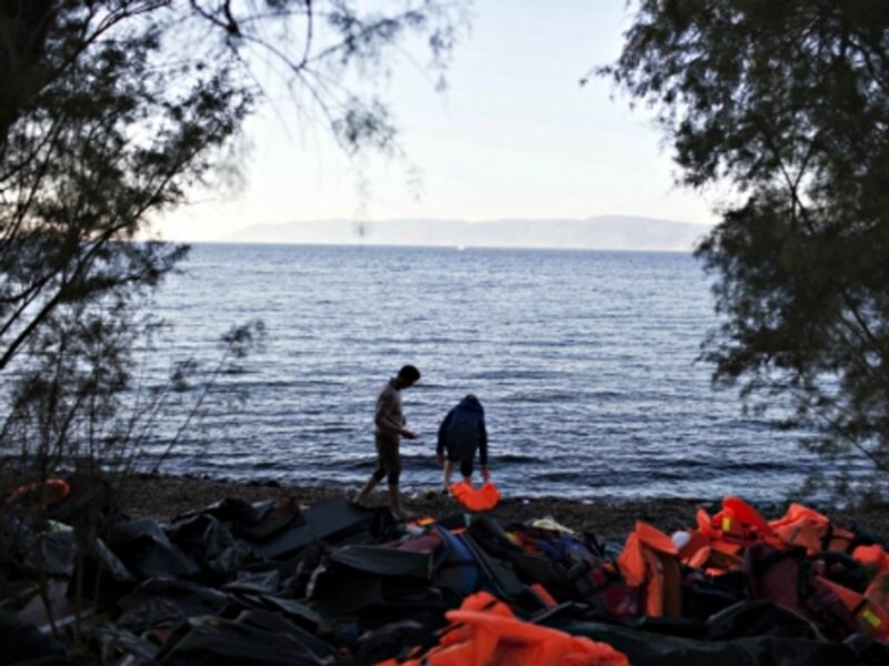 Refugees arriving on the Greek island of Lesbos after crossing from Turkey on a dinghy