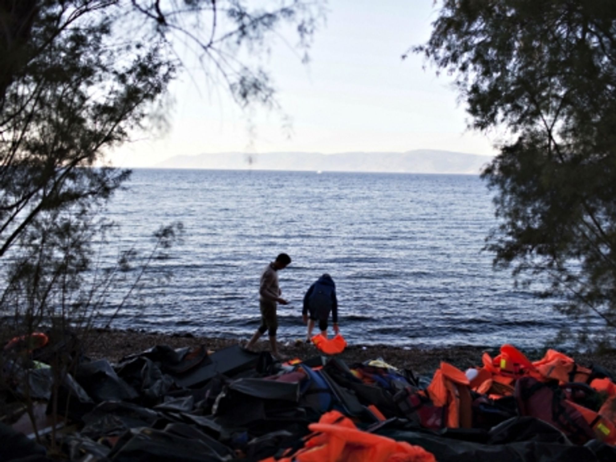Refugees arriving on the Greek island of Lesbos after crossing from Turkey on a dinghy