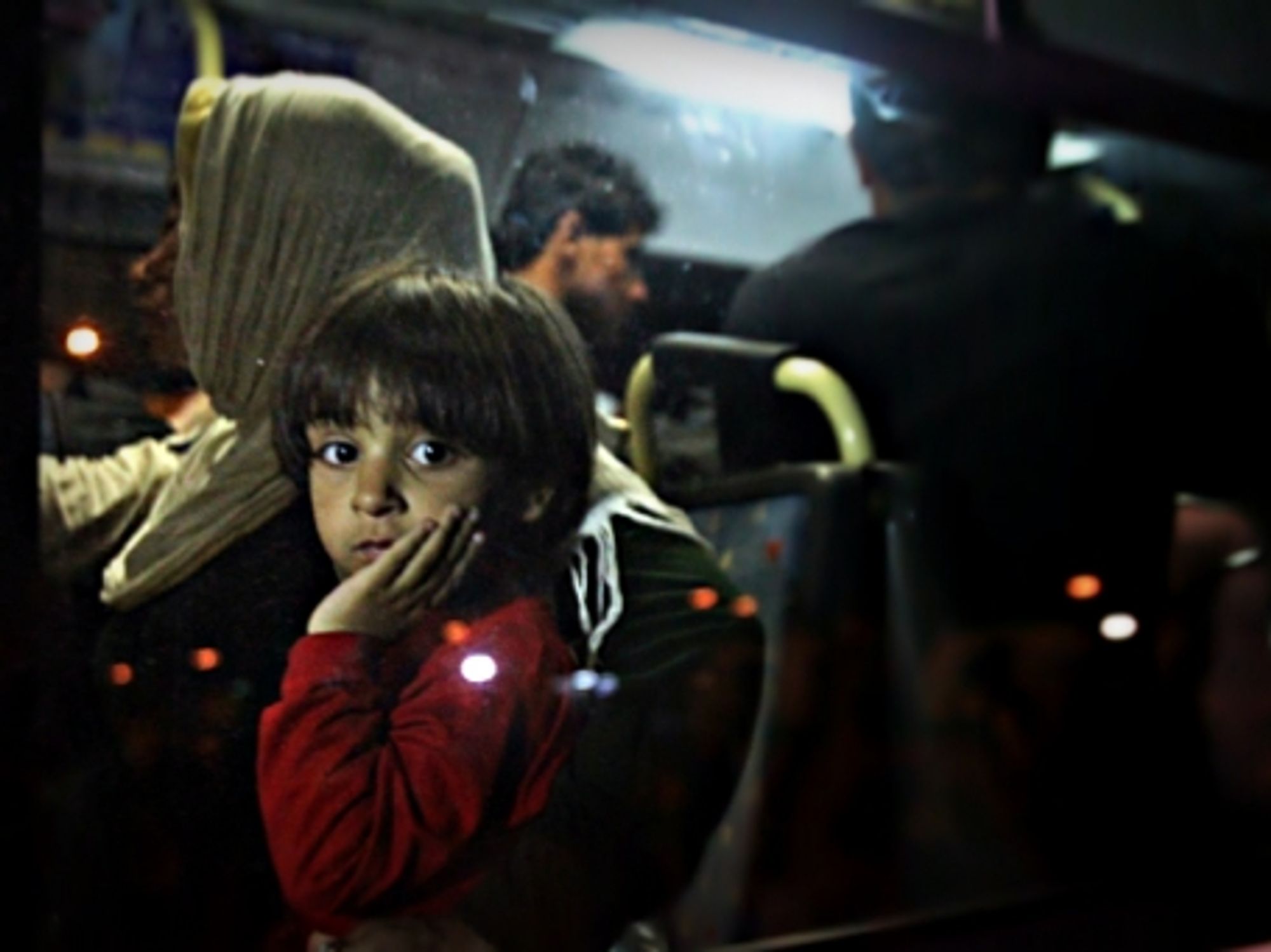 Refugees from Syria and Afghanistan arriving in Athens on Aug. 26