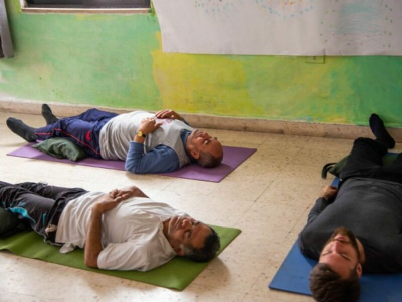 Refugees taking part in a yoga class in Amman
