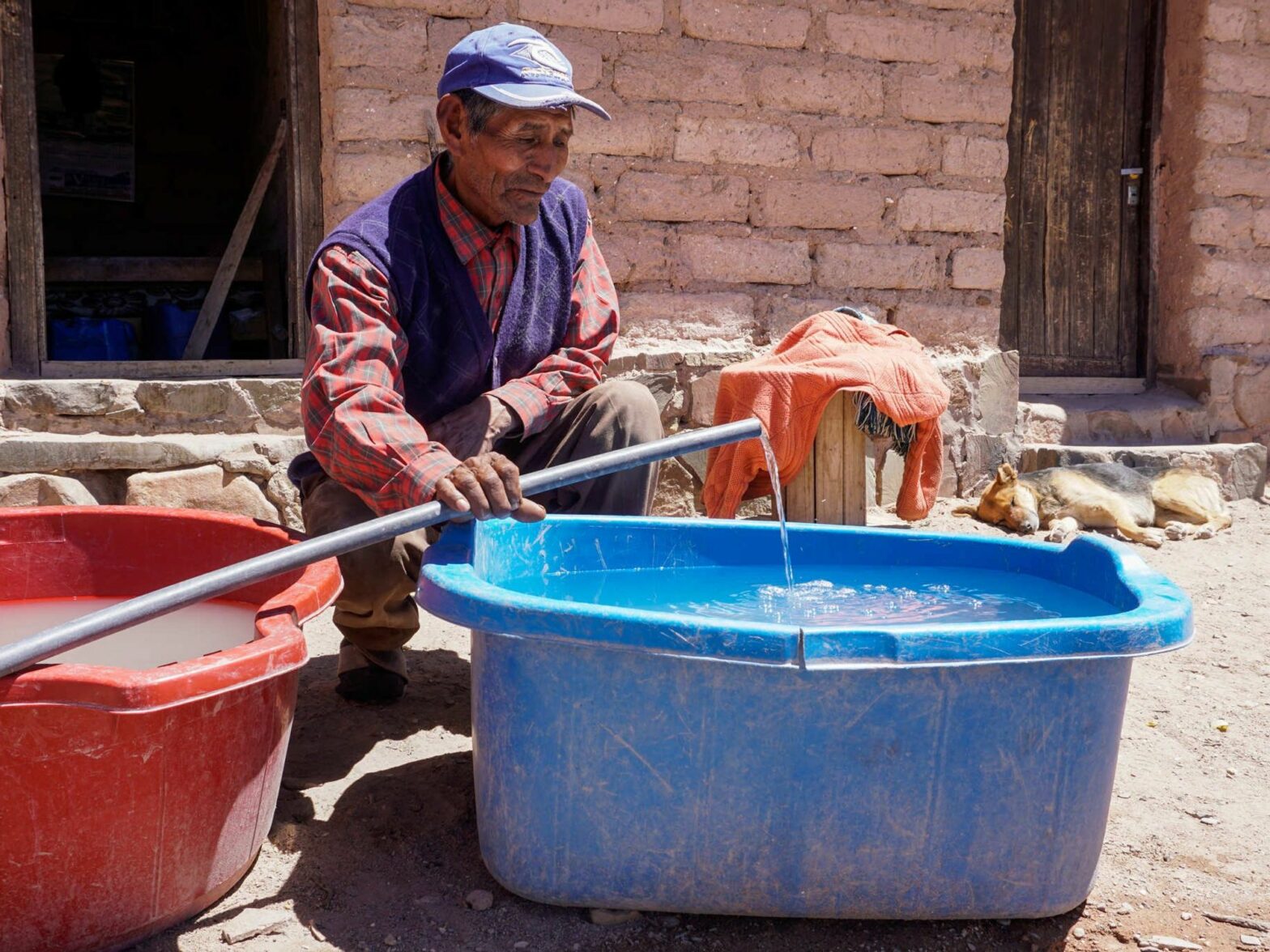 Reinaldo Luzco fills two tanks with river water. The well he relied on for potable water dried up three years ago, and now he’s sometimes forced to collect drinking water from a river that naturally contains arsenic.