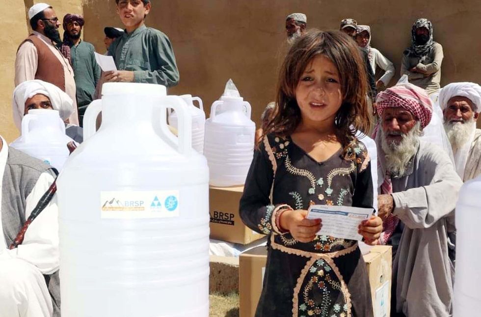 Relief goods are being distributed among people affected by the floods in Quetta, Pakistan