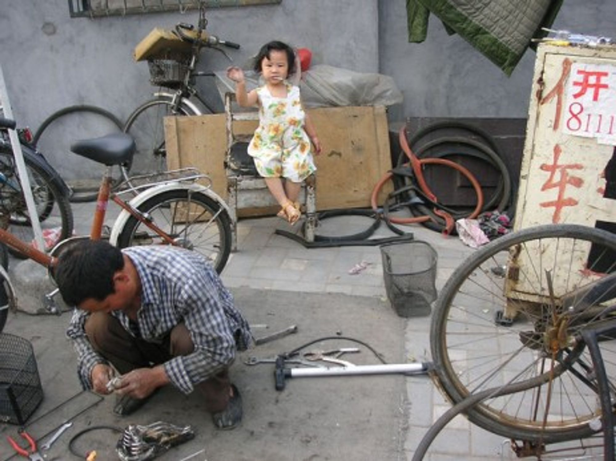 Repairing a Chinese bicycle in Beijing (Kim S)
