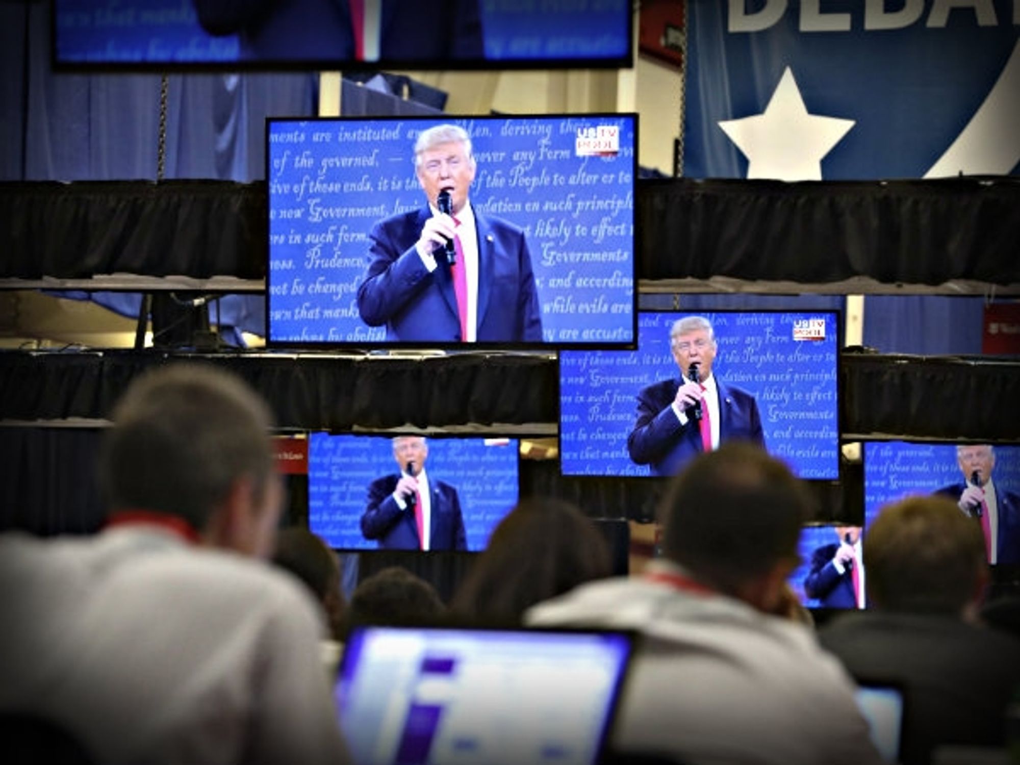 Reporters watch the second debate last month in St. Louis