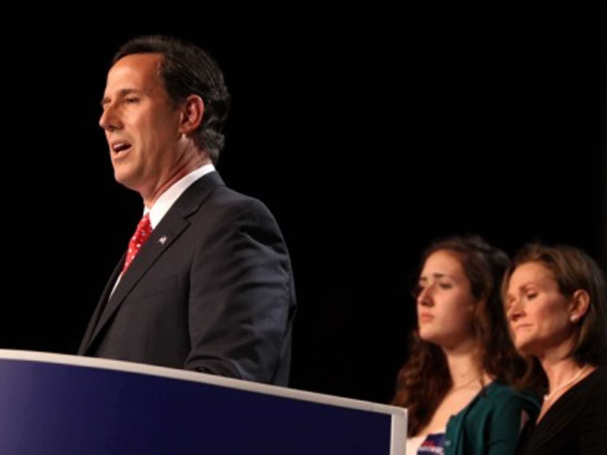 Republican presidential candidate Rick Santorum with his wife and one of their seven children (Gage Skidmore)