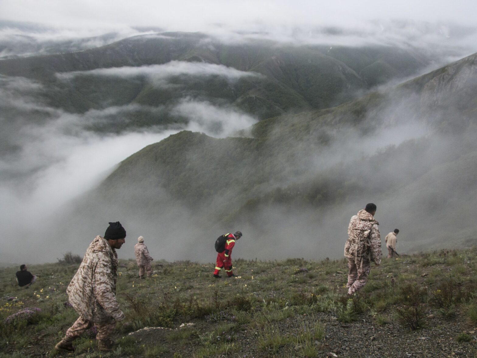 Rescue team members work at the crash site of a helicopter which killed Iranian Prime Minister Raisi, in north-west Iran.​