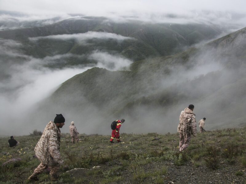 Rescue team members work at the crash site of a helicopter which killed Iranian Prime Minister Raisi, in north-west Iran.​