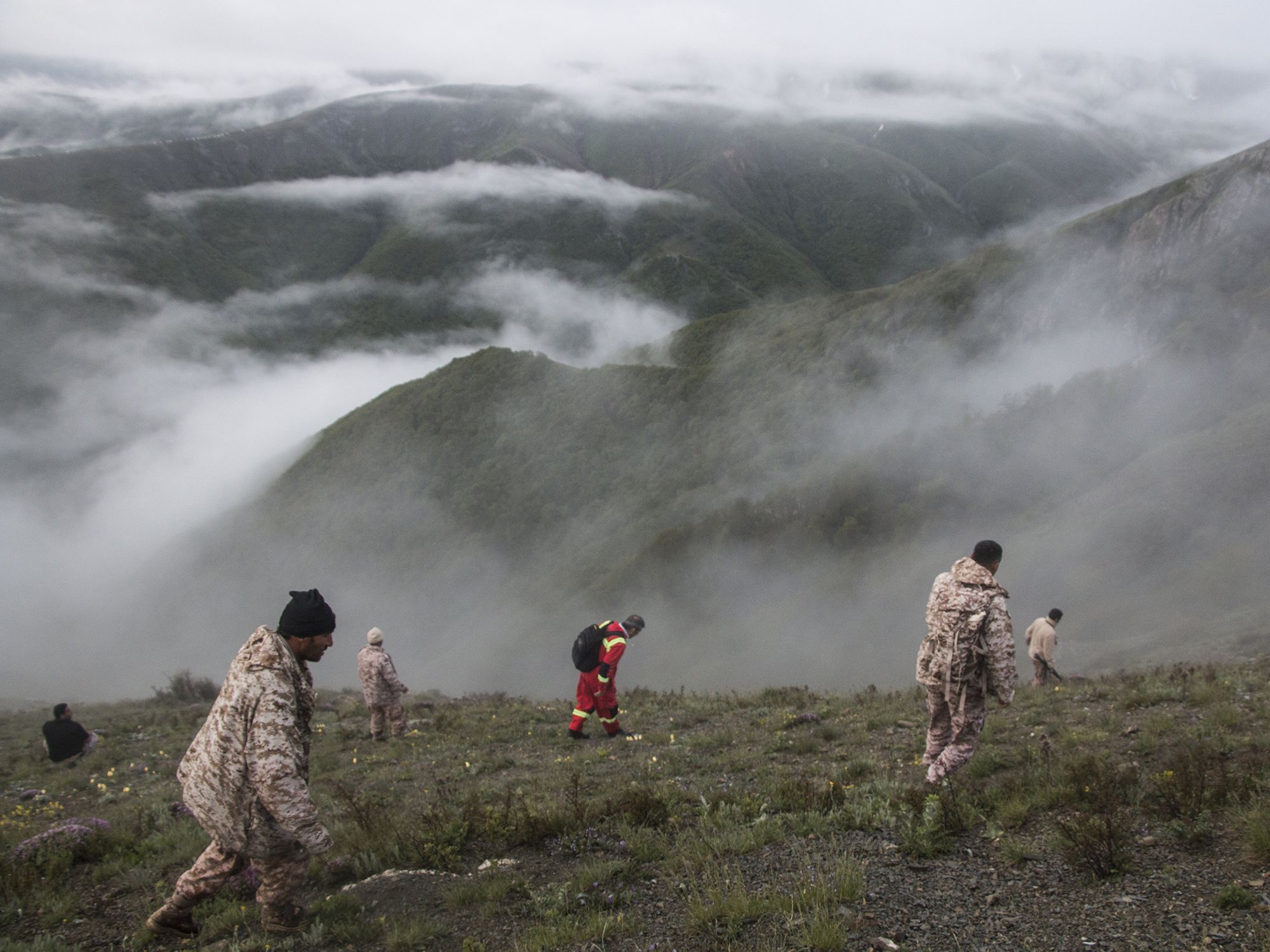 Rescue team members work at the crash site of a helicopter which killed Iranian Prime Minister Raisi, in north-west Iran.​