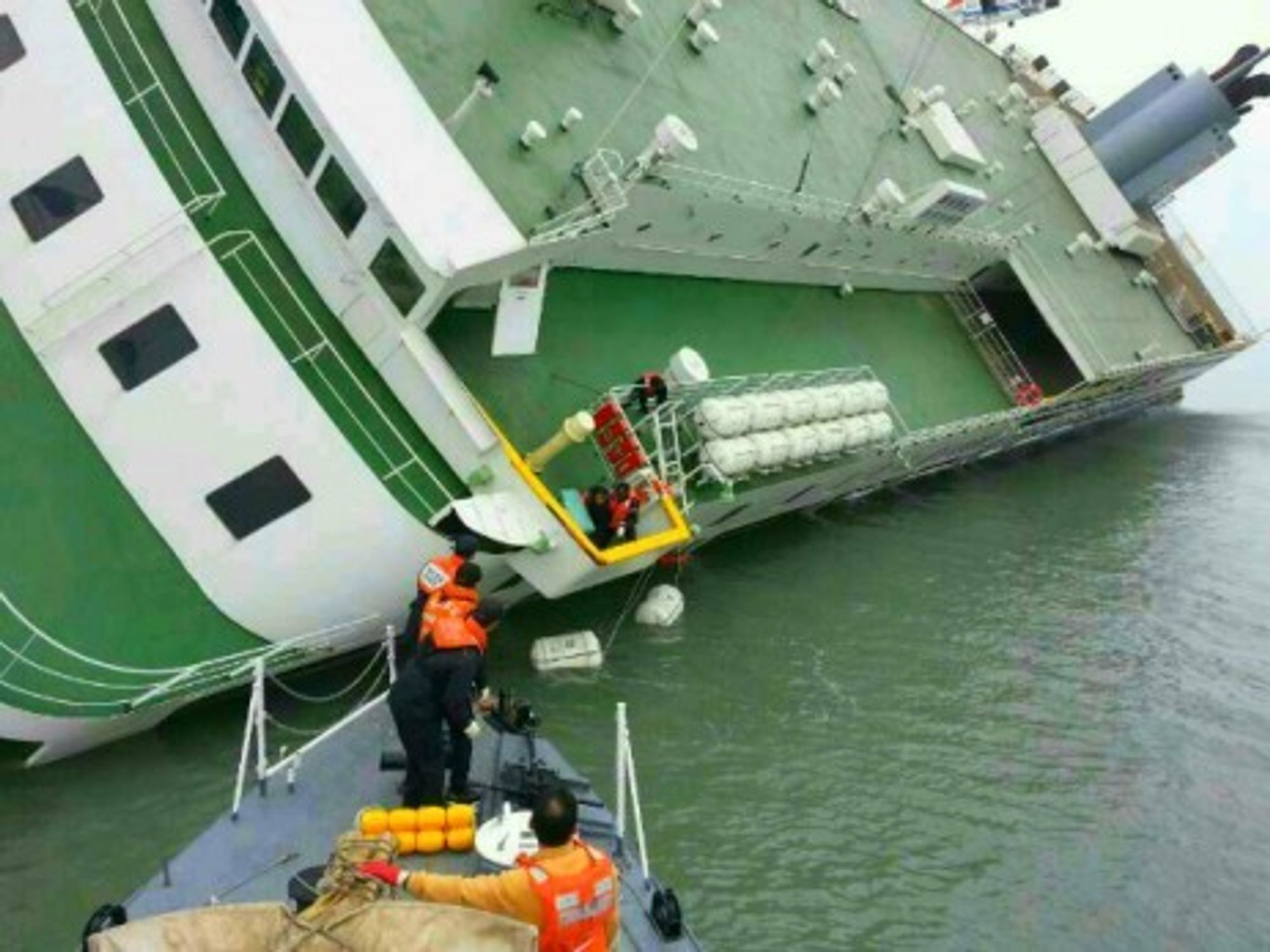 Rescue teams are still searching for some 300 people one day after a boat carrying 475 passengers capsized off the S. Korean coast
