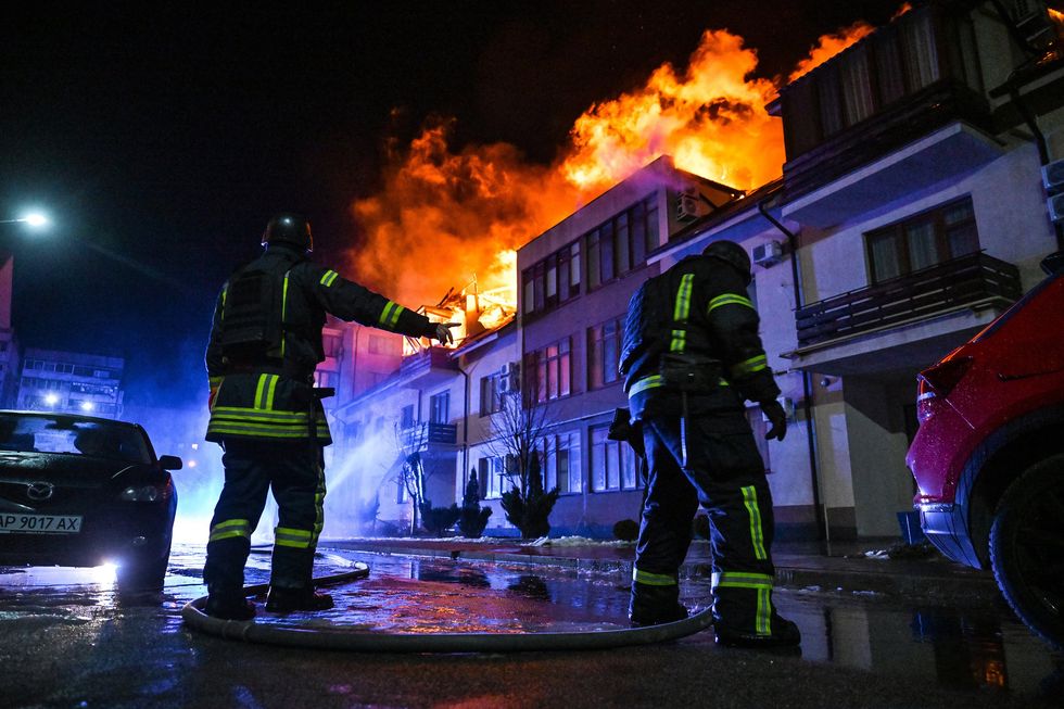 Rescuers extinguish the fire caused by a Russian drone fall on a residential building, Zaporizhzhia, Ukraine, on March 1, 2025.