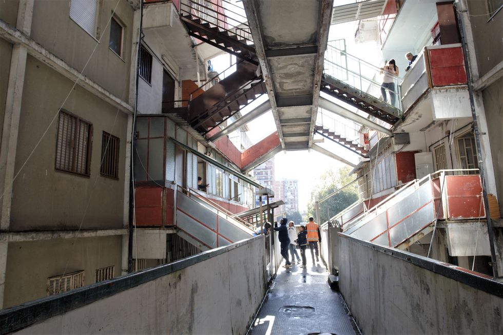 Residents of a block in Le Vele di Scampia take a final tour of the building before being moved to a safer home in 2016.