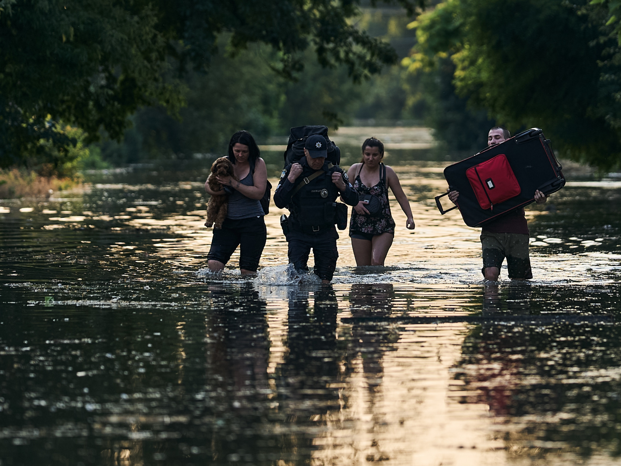 Residents of occupied Ukrainian towns flee flooding from the Nova Kakhova Dam explosion