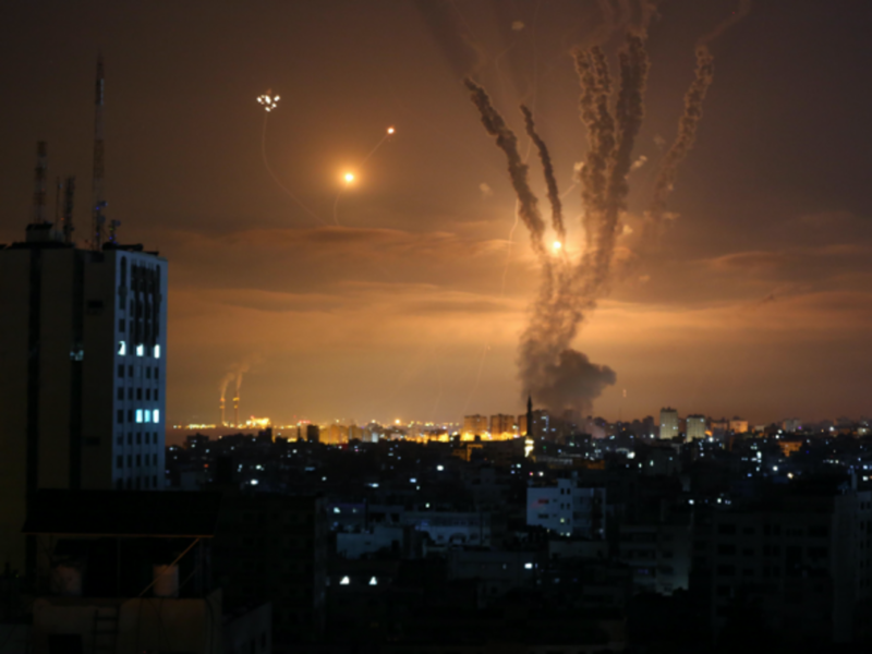 Rockets are seen in the night sky fired towards Israel from the northern Gaza Strip on May 14, 2021