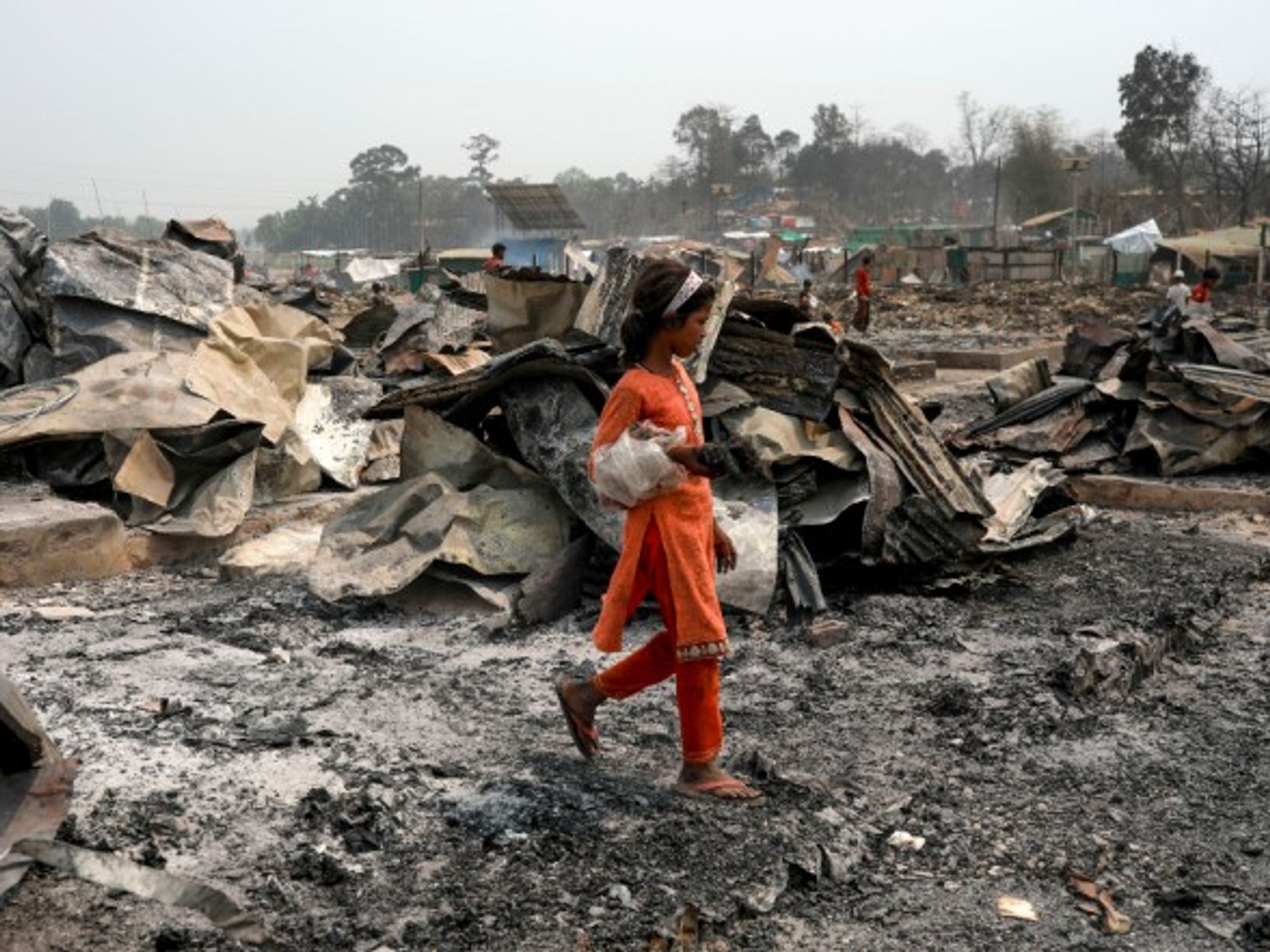 Rohingya refugees search for their belongings after a fire killed at least 15 people and injured more than 500 in a camp in Cox’s Bazar, Bangladesh.