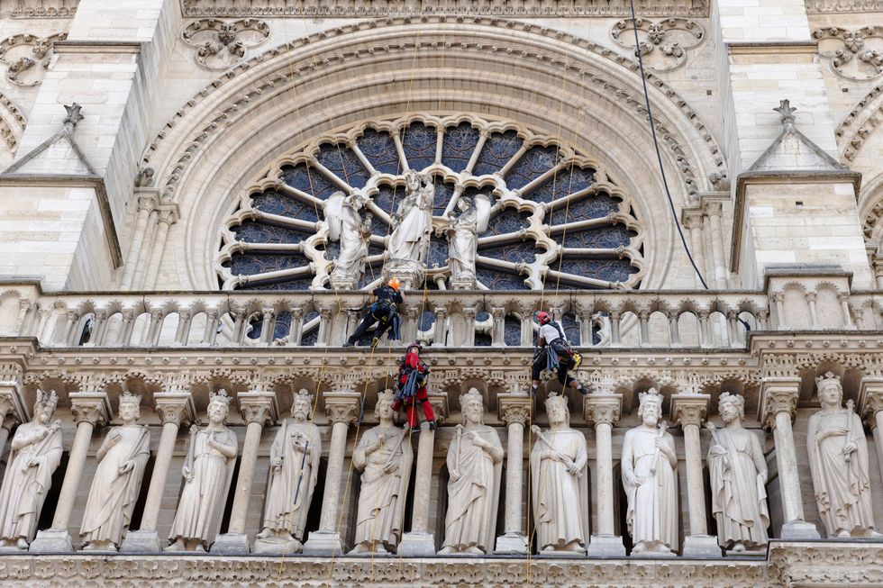 Rope access technicians meticulously restore the vaulted ceilings of Notre-Dame de Paris, removing debris and reinforcing structures, showcasing their expertise in high-altitude operations.