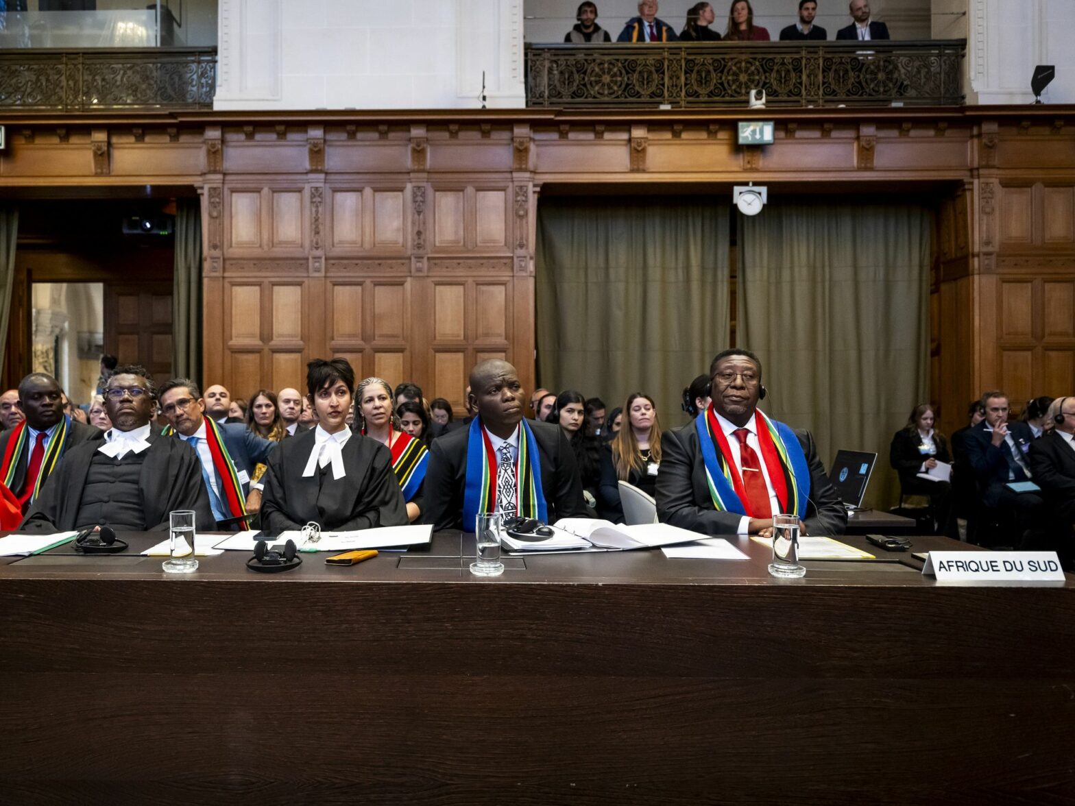 Row of South African lawyers looking forward listening.