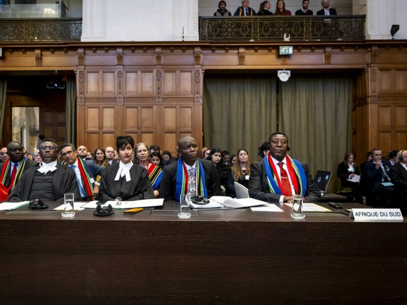 Row of South African lawyers looking forward listening.