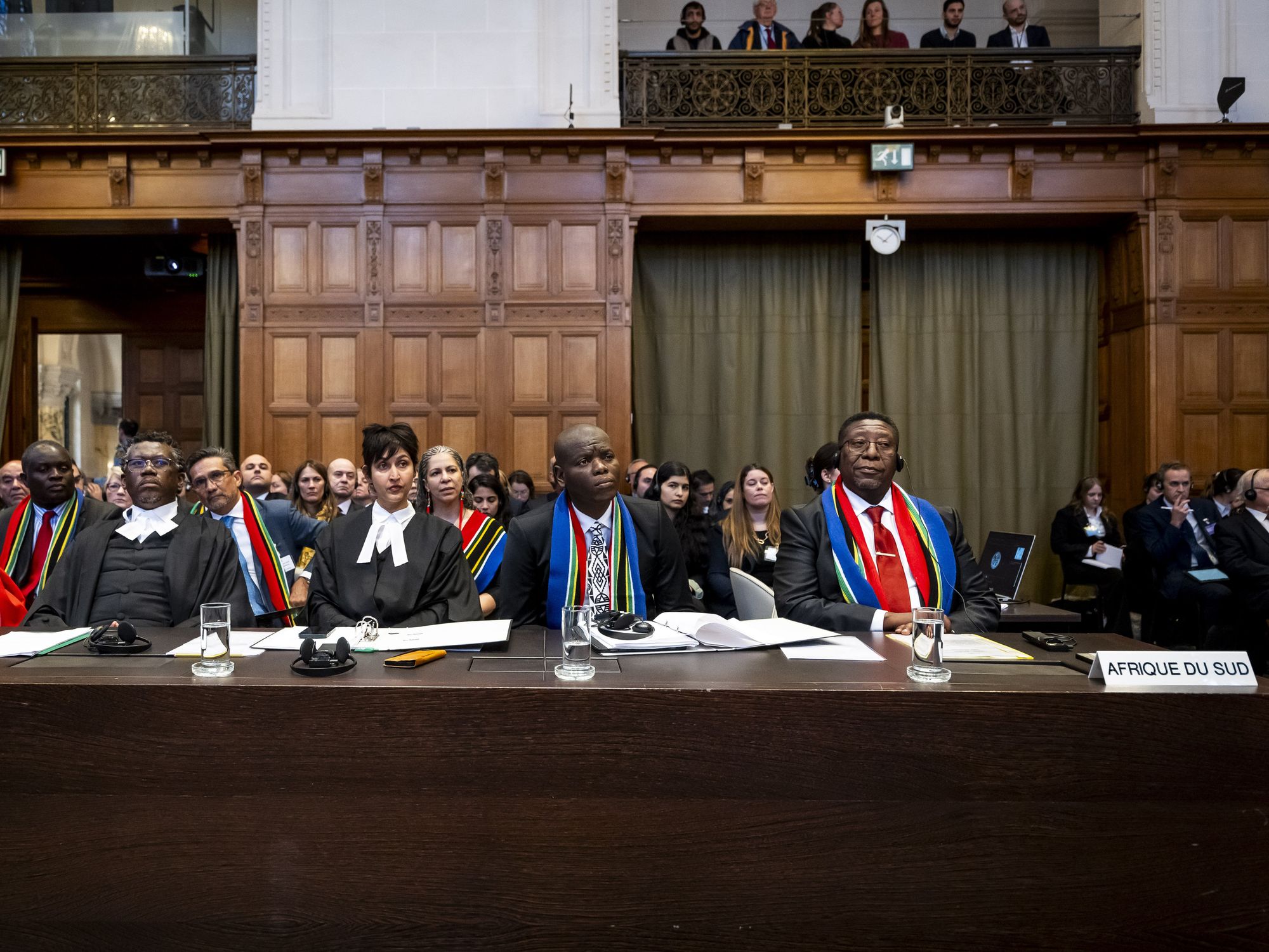Row of South African lawyers looking forward listening.