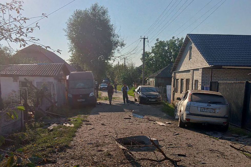 Rubble covers the ground after a military strike on the town of Valuyki, 15km north of the Ukrainian border