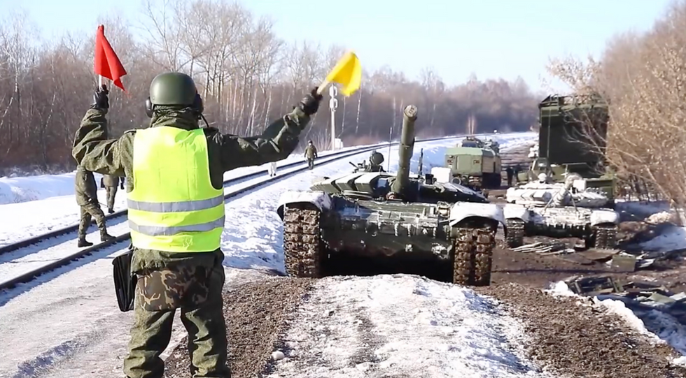 Russian army tanks are loaded onto railway platforms to move back to their permanent base after drills. on Feb. 16, 2022