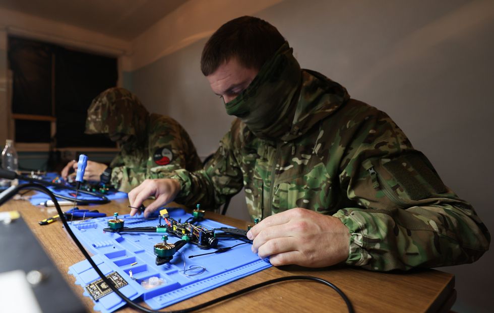 Russian drone pilots learn to fly drones on simulators and to assemble drones in a facility.