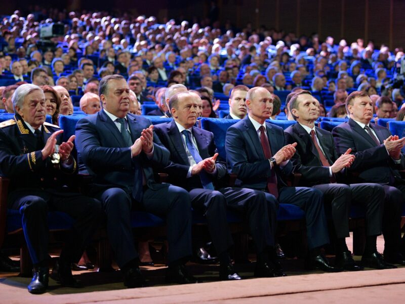 Russian Federal Protective Service Head Dmitry Kochnev (2nd L), Russian Federal Security Service (FSB) Chief Alexander Bortnikov (3rd R), Russia's President Vladimir Putin (4th L), and Russian Foreign Intelligence Service Chief Sergei Naryshkin (2nd R front) at a concert marking Russian Security Agency Officer Day