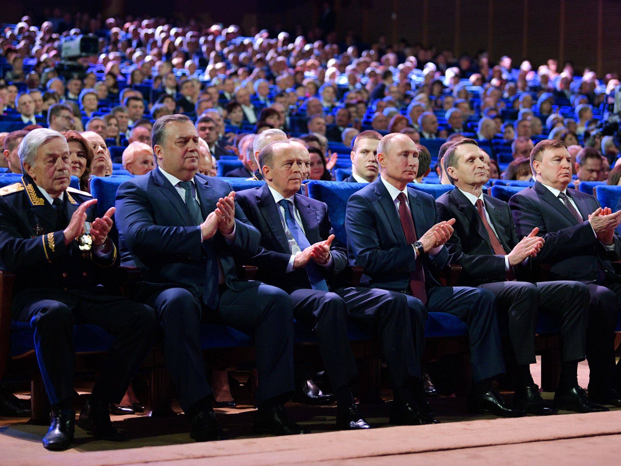 Russian Federal Protective Service Head Dmitry Kochnev (2nd L), Russian Federal Security Service (FSB) Chief Alexander Bortnikov (3rd R), Russia's President Vladimir Putin (4th L), and Russian Foreign Intelligence Service Chief Sergei Naryshkin (2nd R front) at a concert marking Russian Security Agency Officer Day