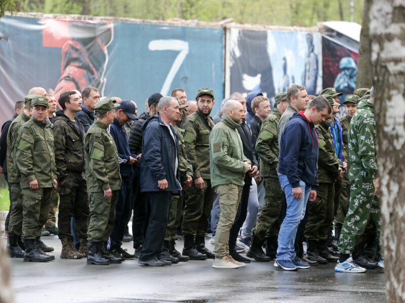 Russian men wait in line outside a contract enlistment station in Balashikha near Moscow.