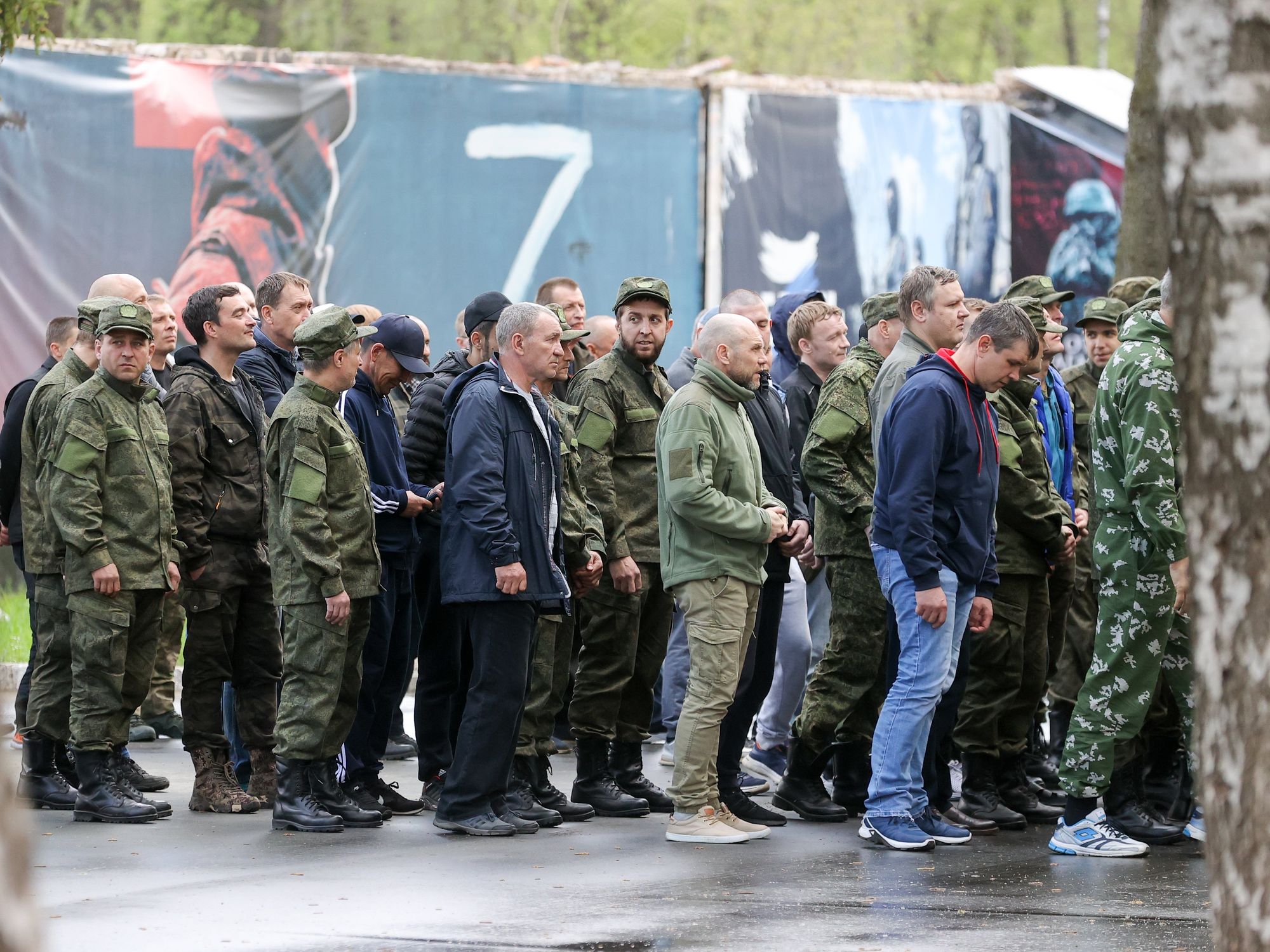 Russian men wait in line outside a contract enlistment station in Balashikha near Moscow.