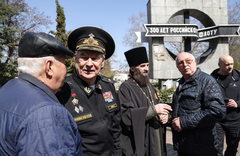 Russian Navy veterans attend a memorial event held for the Moskva guided missile cruiser.