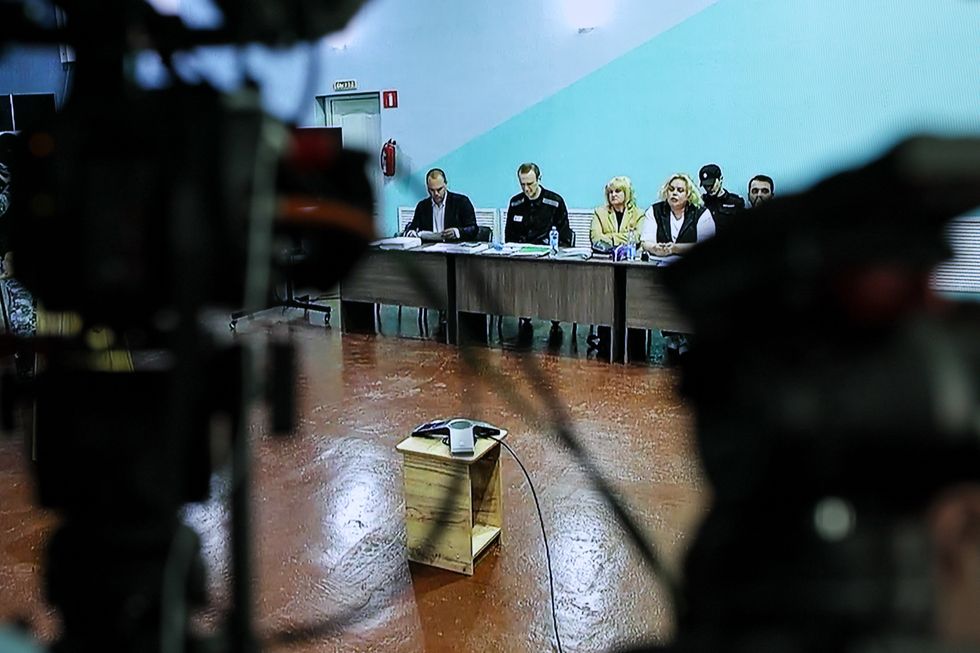 Russian opposition activist Alexei Navalny, his lawyers Vadim Kobzev and Olga Mikhailova during a visiting session of the Moscow City Court.