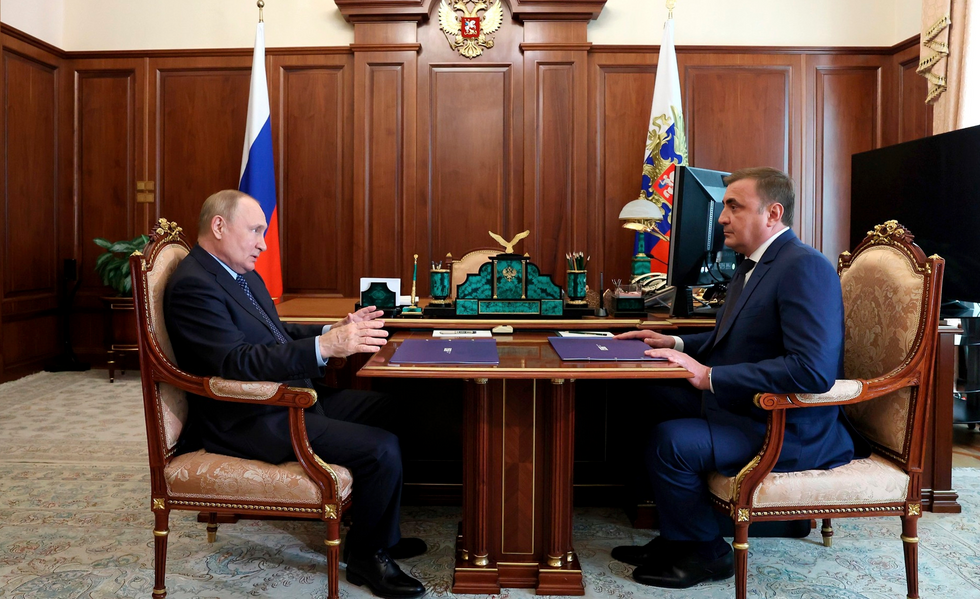 Russian President Vladimir Putin holds a face-to-face meeting with the Governor of the Tula Region Alexei Dyumin, right, to discuss the economic situation in the Republic, at the Kremlin.