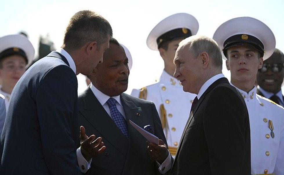 Russian President Vladimir Putin speaking to Congo President Denis Sassou Nguesso.