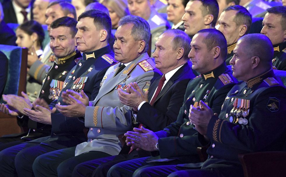 Russian president Vladimir Putin with army generals in 2019
